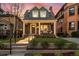 Charming brick home with a covered front porch, columns, and landscaped front yard at 1730 N Gaylord St, Denver, CO 80206