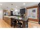 Modern kitchen features stainless steel appliances, hardwood floors, and exposed brick at 1730 N Gaylord St, Denver, CO 80206