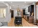 Modern kitchen features stainless steel appliances, hardwood floors, and an island at 1730 N Gaylord St, Denver, CO 80206