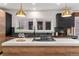 Modern kitchen features stainless steel appliances, hardwood floors, and a kitchen island at 1730 N Gaylord St, Denver, CO 80206