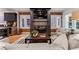 Cozy living room with modern fireplace, large TV, comfortable seating, and open layout at 1730 N Gaylord St, Denver, CO 80206