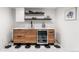 Modern wet bar featuring wooden cabinetry, sleek countertops, and a wine fridge at 1730 N Gaylord St, Denver, CO 80206