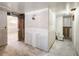 Unfinished basement featuring a toilet and plumbing, awaiting renovation and design at 4291 W Wagon Trail Dr, Littleton, CO 80123