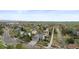 A panoramic aerial view showing a residential neighborhood with green spaces at 650 Olympia Ave, Longmont, CO 80504