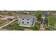 Home's backyard aerial view showing a stone patio, lawn, and fenced yard at 650 Olympia Ave, Longmont, CO 80504