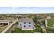 Home's backyard aerial view showing a stone patio, lawn, and fenced yard at 650 Olympia Ave, Longmont, CO 80504