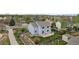 A backyard aerial view with green lawn, wood fence and a stone patio at 650 Olympia Ave, Longmont, CO 80504