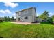 Expansive backyard offers ample green space, a patio area, and a serene environment for relaxation and recreation at 650 Olympia Ave, Longmont, CO 80504