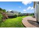 Spacious backyard featuring a well-maintained lawn, mature trees, and a patio area perfect for outdoor entertaining at 650 Olympia Ave, Longmont, CO 80504