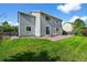 Green backyard has access to the building from the outdoor patio through a sliding glass door at 650 Olympia Ave, Longmont, CO 80504