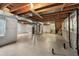 Spacious unfinished basement with exposed ceiling, perfect for storage and customization at 650 Olympia Ave, Longmont, CO 80504
