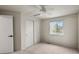 Bedroom with a ceiling fan, closet and a window providing natural light at 650 Olympia Ave, Longmont, CO 80504