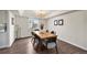 Stylish dining room with modern lighting and a natural wood table at 650 Olympia Ave, Longmont, CO 80504