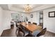 Elegant dining area with views of the living room and stylish modern lighting at 650 Olympia Ave, Longmont, CO 80504