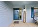 Inviting entryway with a 'Welcome' sign and charming details at 650 Olympia Ave, Longmont, CO 80504