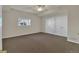 Spacious bedroom with neutral colors, ceiling fan, window and double closet with hardware at 11017 Meade Ct, Westminster, CO 80031