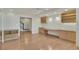 Open bonus room with hardwood flooring, built-in desk, and plenty of natural light at 11017 Meade Ct, Westminster, CO 80031
