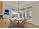 Bright dining area with stylish chandelier and outdoor access, ideal for enjoying meals with a view at 11017 Meade Ct, Westminster, CO 80031