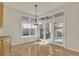 Bright dining area with ample natural light, wood floors, and easy access to outdoor patio at 11017 Meade Ct, Westminster, CO 80031