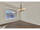 Clean dining room featuring a large window and contemporary lighting at 11017 Meade Ct, Westminster, CO 80031