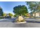 Community entrance with a boulder sign, landscaping, and gated entries to the Hilltop neighborhood at 11017 Meade Ct, Westminster, CO 80031