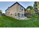 Beautifully landscaped backyard with stone accents, patio and lush green lawn at 11017 Meade Ct, Westminster, CO 80031