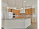 Spacious kitchen featuring granite countertops, an island with bar seating, and stainless steel appliances at 11017 Meade Ct, Westminster, CO 80031