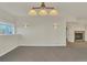 Spacious living room with neutral carpet, a fireplace and ample natural light at 11017 Meade Ct, Westminster, CO 80031