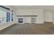 Bright living room with large windows, fireplace, and built-in shelving, creating a welcoming space at 11017 Meade Ct, Westminster, CO 80031