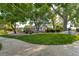Community park featuring playground, benches and sign surrounded by lush greenery at 11017 Meade Ct, Westminster, CO 80031