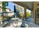 Outdoor patio with seating area, umbrella, view of surrounding trees and landscaping at 11017 Meade Ct, Westminster, CO 80031