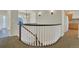 Carpeted staircase with decorative white railings and hardwood trim at 11017 Meade Ct, Westminster, CO 80031