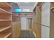 Bright walk-in closet with custom shelving, drawers, and ample storage space at 11017 Meade Ct, Westminster, CO 80031