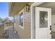 Inviting back porch with wooden floors and a serene view of the neighborhood at 4529 Barnacle Ct, Boulder, CO 80301