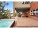 Backyard featuring an outdoor hot tub, a patio area and view of the open green space at 7086 Esperanza Dr, Castle Pines, CO 80108