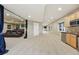 Finished basement with a wet bar and media room at 7086 Esperanza Dr, Castle Pines, CO 80108