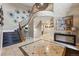 Elegant foyer with decorative tile flooring, a grand staircase, and stylish wall art, creating a welcoming entrance at 7086 Esperanza Dr, Castle Pines, CO 80108