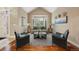 Bright living room with vaulted ceilings and a large bay window, allowing for natural light at 7086 Esperanza Dr, Castle Pines, CO 80108