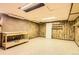 Utility basement features wood paneling and a work bench, offering functional space at 5876 W Canyon Ave, Littleton, CO 80128