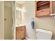 A compact bathroom with a shower and vanity cabinet with drawers at 5876 W Canyon Ave, Littleton, CO 80128
