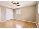 This primary bedroom features hardwood floors and a large closet at 5876 W Canyon Ave, Littleton, CO 80128