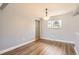 The dining room features hardwood floors and a chandelier at 5876 W Canyon Ave, Littleton, CO 80128