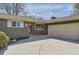Charming single-story home features a well-manicured lawn, a driveway, and a two-car garage at 5876 W Canyon Ave, Littleton, CO 80128
