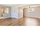 A beautifully updated living room has hardwood floors and fresh neutral paint at 5876 W Canyon Ave, Littleton, CO 80128