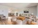 Bright living room with hardwood floors, neutral paint, and modern furnishings at 5876 W Canyon Ave, Littleton, CO 80128