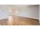 A spacious living room features new hardwood floors and light gray paint at 5876 W Canyon Ave, Littleton, CO 80128