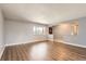 Bright living room features hardwood floors, neutral paint, and an open layout at 5876 W Canyon Ave, Littleton, CO 80128