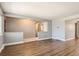 Bright living room features hardwood floors, neutral paint, and an open layout at 5876 W Canyon Ave, Littleton, CO 80128