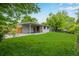 Beautiful view of the expansive backyard featuring an abundance of green space at 8231 E Lehigh Dr, Denver, CO 80237