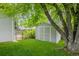 Backyard features a storage shed and well maintained lawn at 8231 E Lehigh Dr, Denver, CO 80237